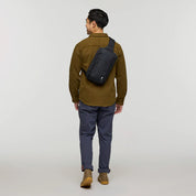Cotopaxi Todo 8L Sling - Cotopaxi  Black View of Sling over shoulder sitting on the back of the person