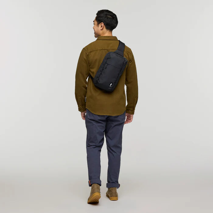 Cotopaxi Todo 8L Sling - Cotopaxi  Black View of Sling over shoulder sitting on the back of the person