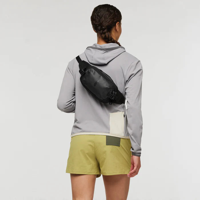 Cotopaxi Allpa X 1.5L Hip Pack - Cotopaxi Black View of wearing over shoulder on the back of the person