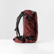Matador GlobeRider35 Travel Backpack - Garnet side view showing backpack straps and pocket