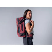 Matador GlobeRider35 Travel Backpack - Garnet lady carrying bag on her back