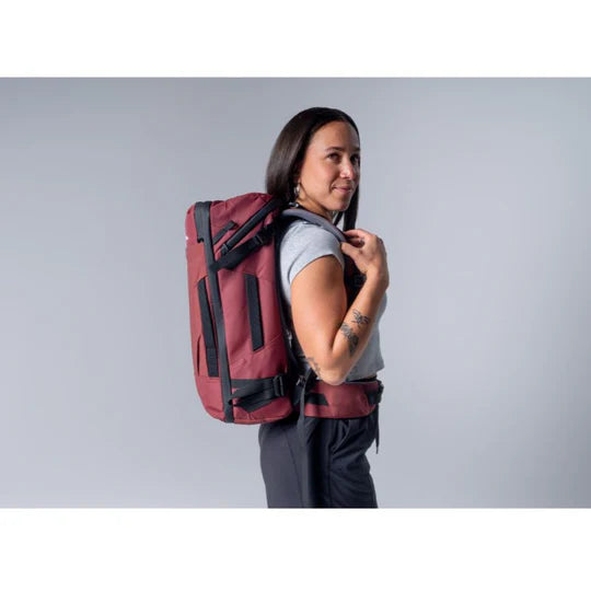 Matador GlobeRider35 Travel Backpack - Garnet lady carrying bag on her back