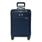 Navy blue suitcase with wheels on a white background